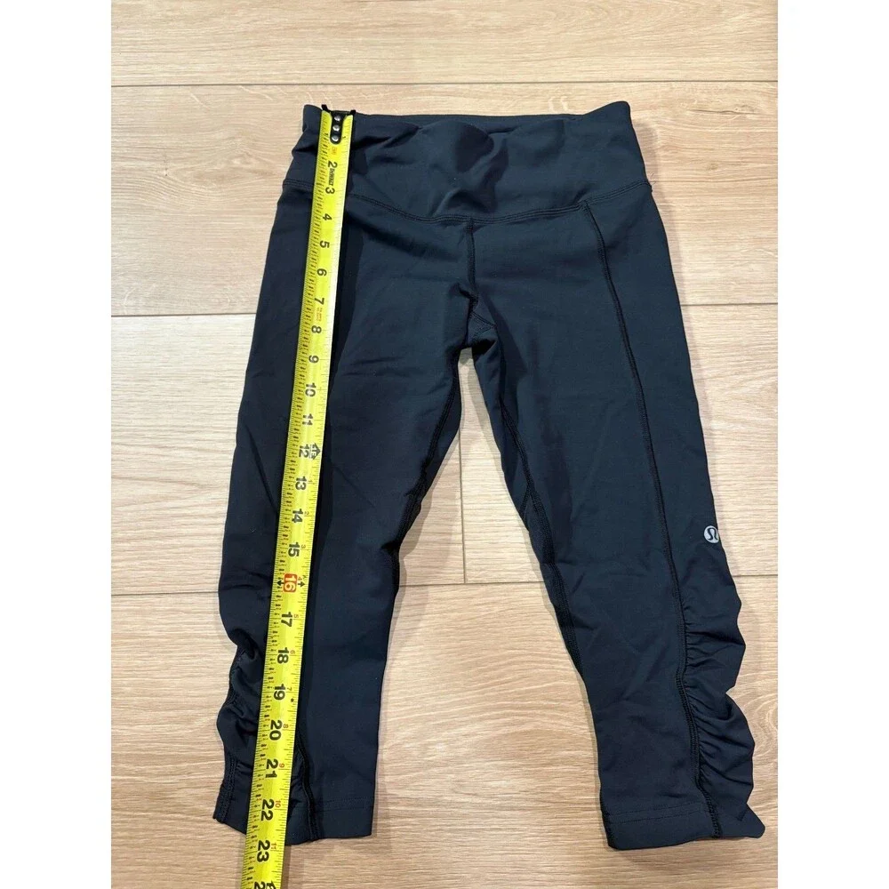Lululemon Black Run Inspire Crop Leggings Ruched Mesh Size 4 Zipper Pocket Yoga